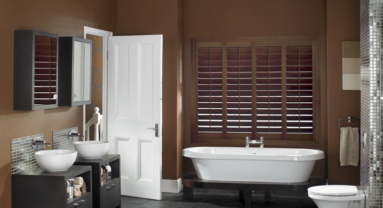 Stained wood shutter in St. George restroom